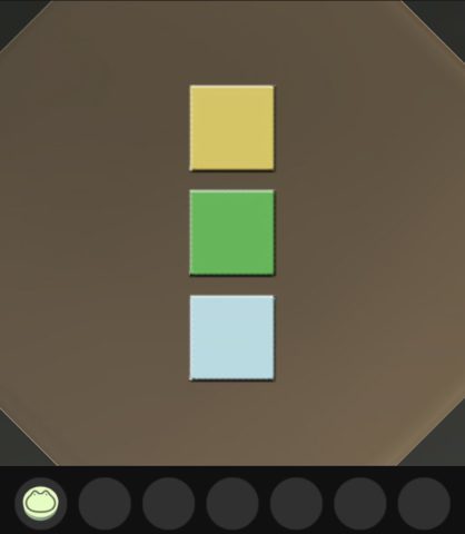 箱には黄、緑、水色のボタンがあります。